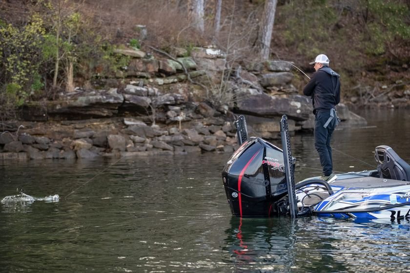 Catalin A. Pop fishing a rocky bank